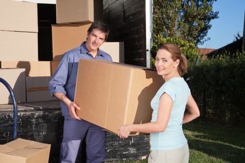 Local movers transporting items from a Sutton flat